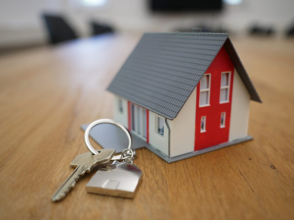 small craft home next to a key on a table